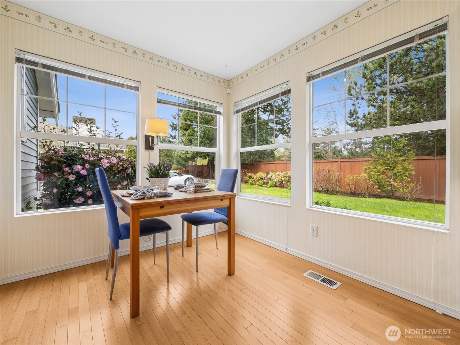 This is a cheerful spot to wake up to! Look at all the natural light & landscaping - bringing the outdoors INSIDE!