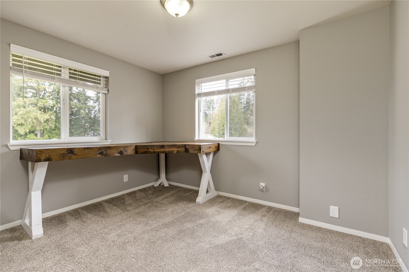 Upstairs bonus/flex room - a versatile space with endless possibilities perfect for a home gym, playroom, library, or creative studio. Custom desk stays!