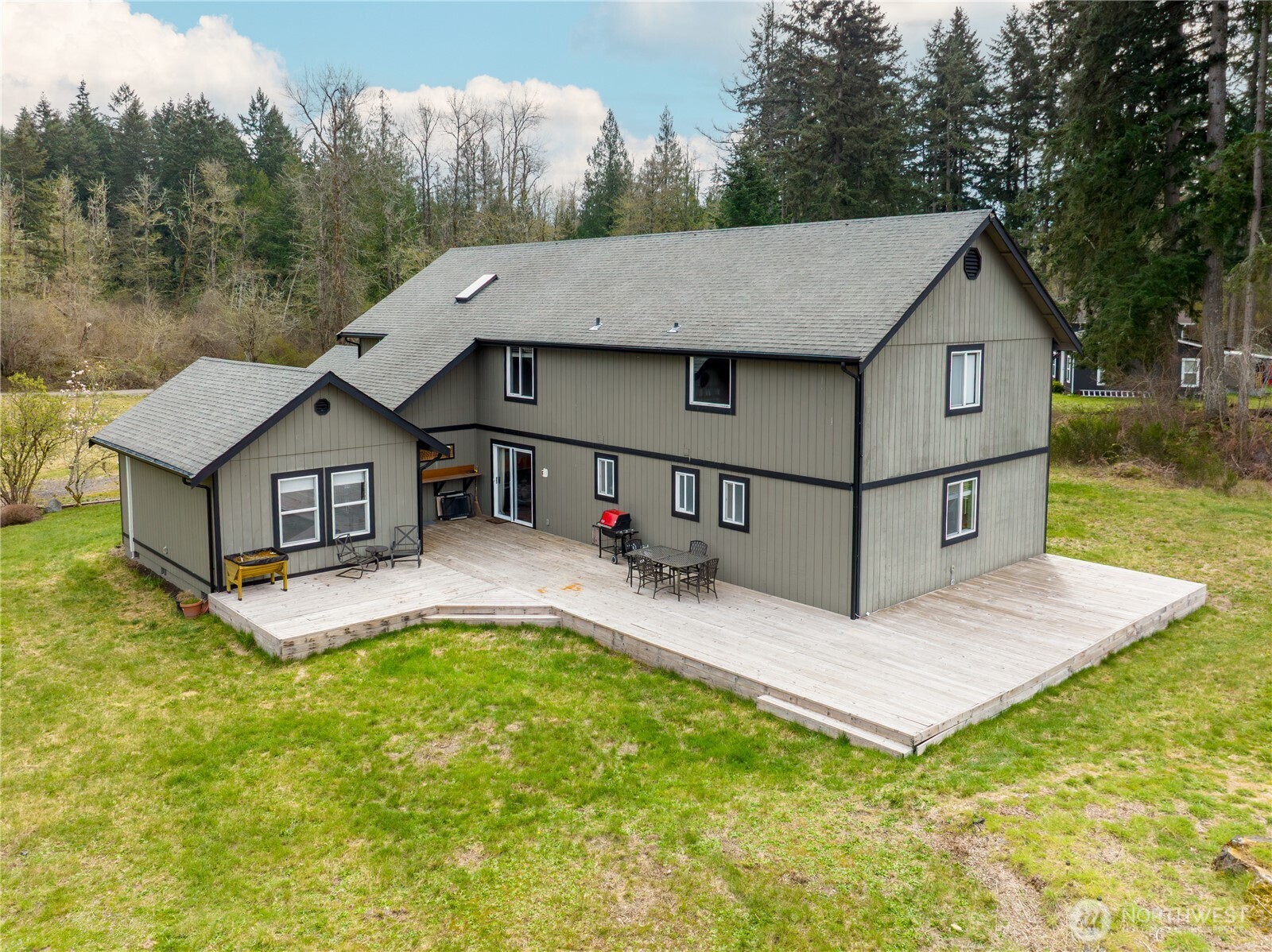 Enjoy the ultimate outdoor retreat on this oversized deck, overlooking a level backyard with endless potential and plenty of room for activities