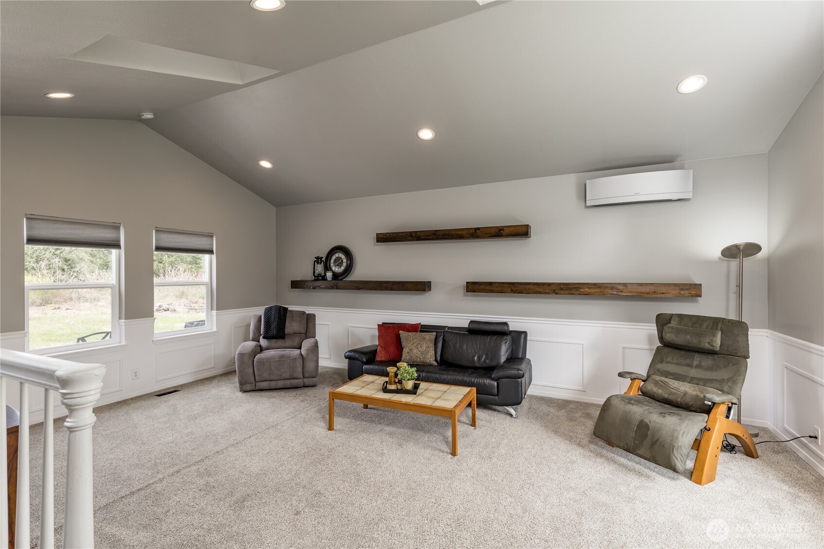 Modern touches meet comfort: stylish floating shelves offer a custom look, while the efficient mini-split system provides perfect climate control year-round