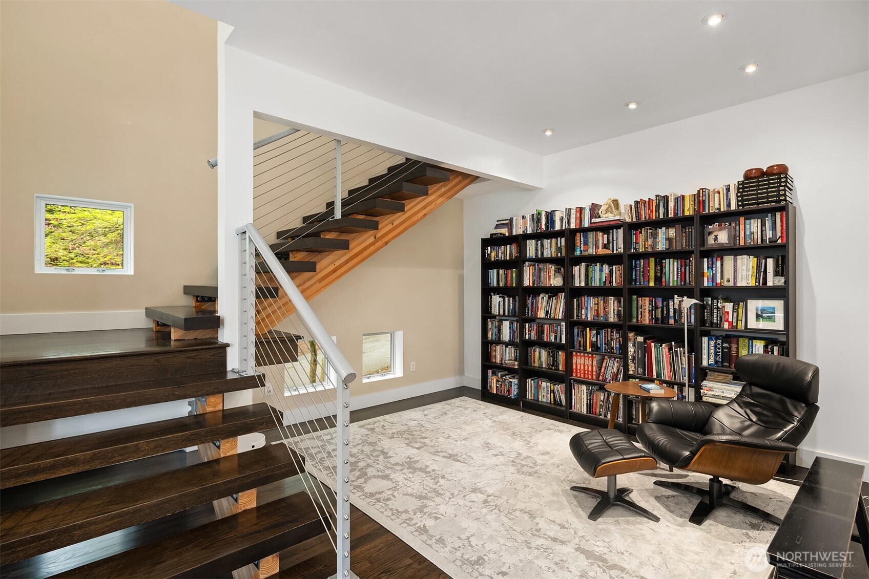 Dedicated library space with custom shelving. Yukimi shoji-style windows bring in natural serenity.