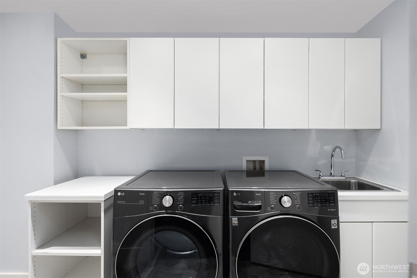 Dedicated laundry area with modern appliances.