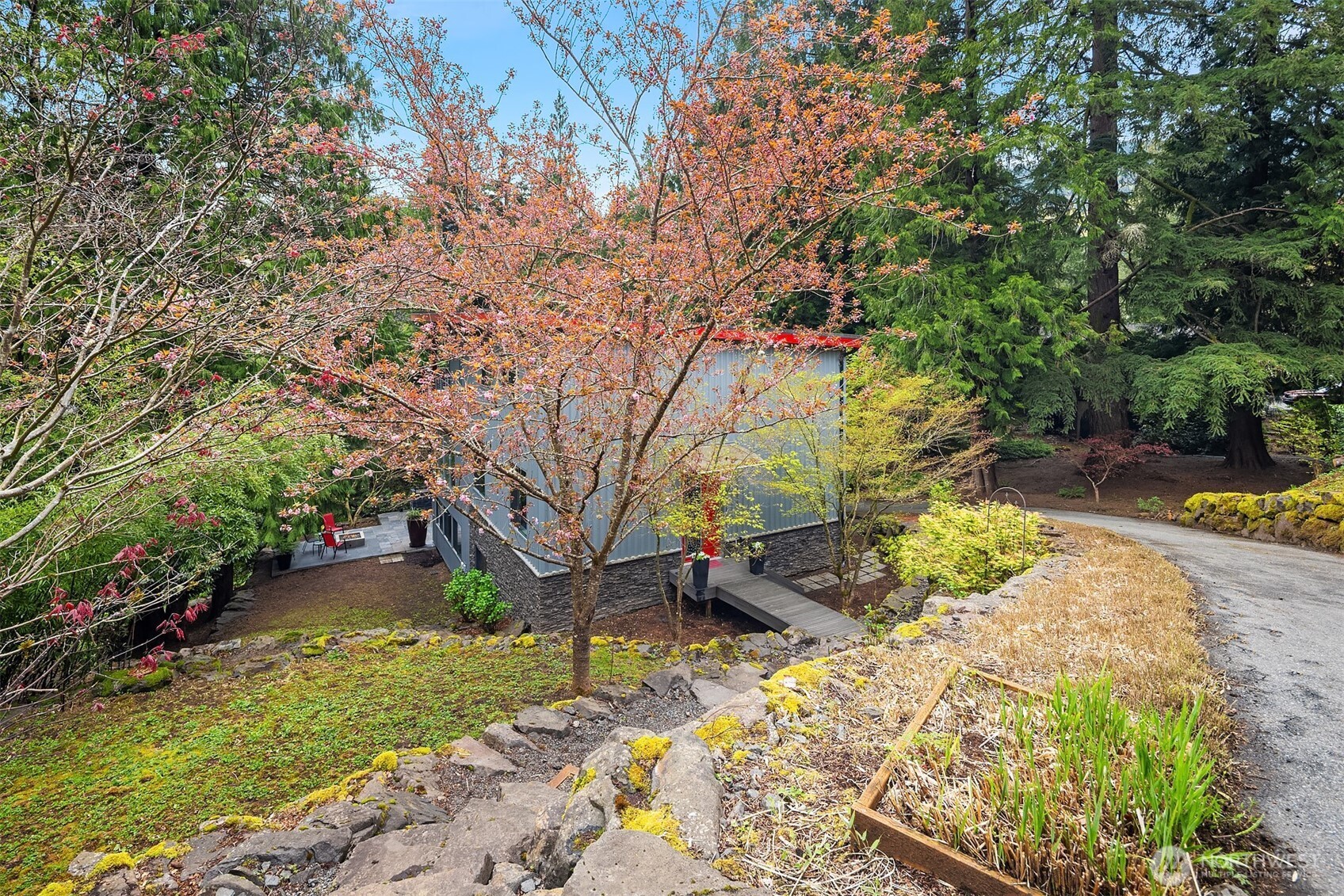 Large patio surrounded by nature and beauty.