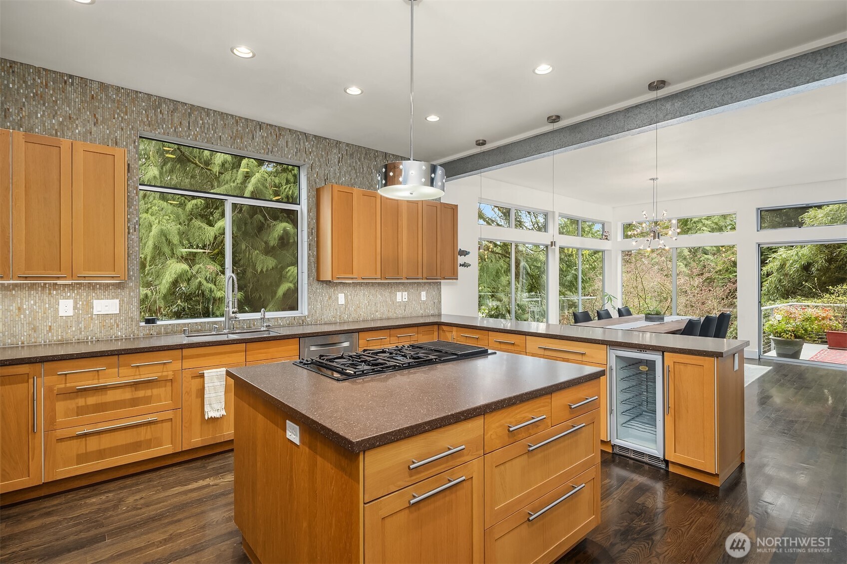 Central island offers prep space and gathering point.