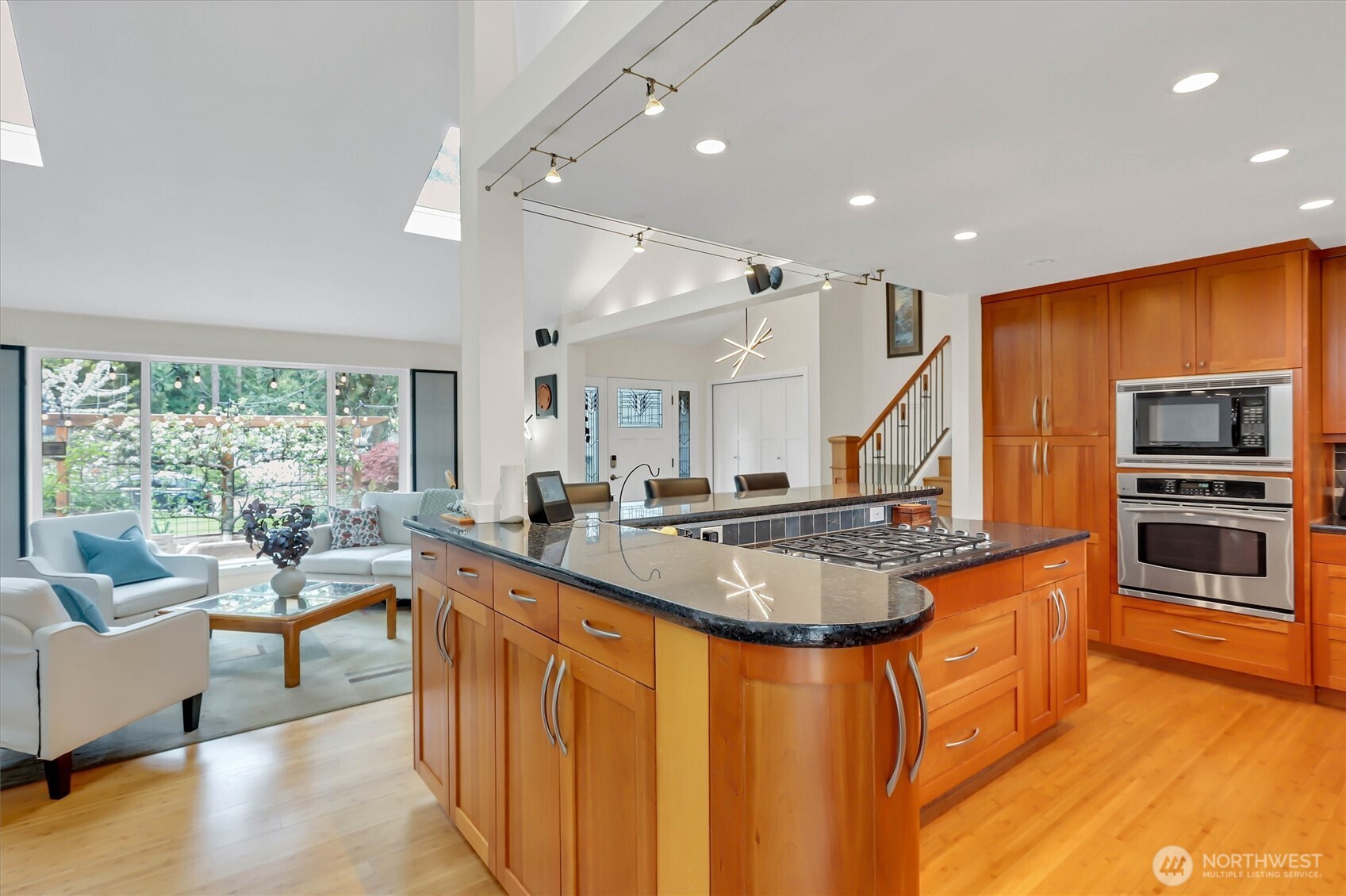 Abundant kitchen cabinets and custom rounded end... not short of space!