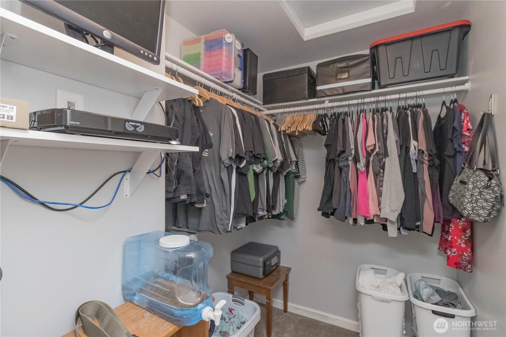 Primary walk-in closet, security system stays with home