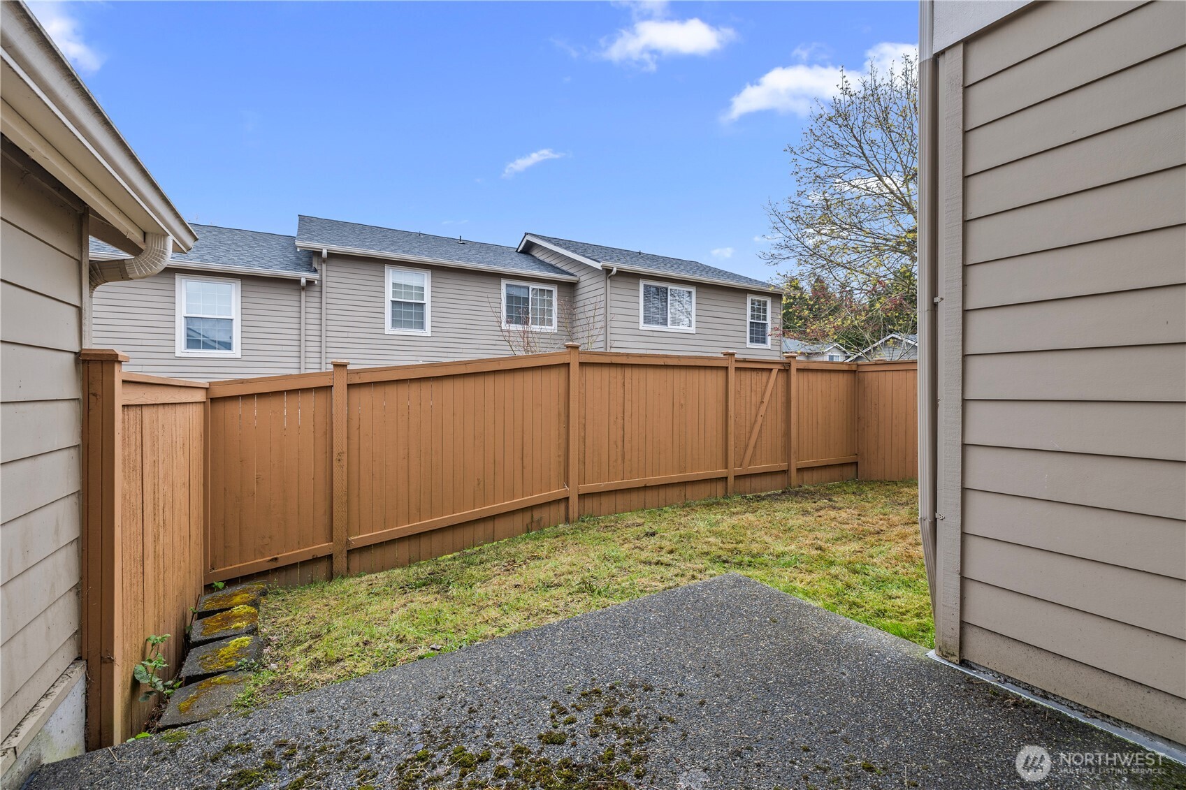 Back patio and fully fenced yard
