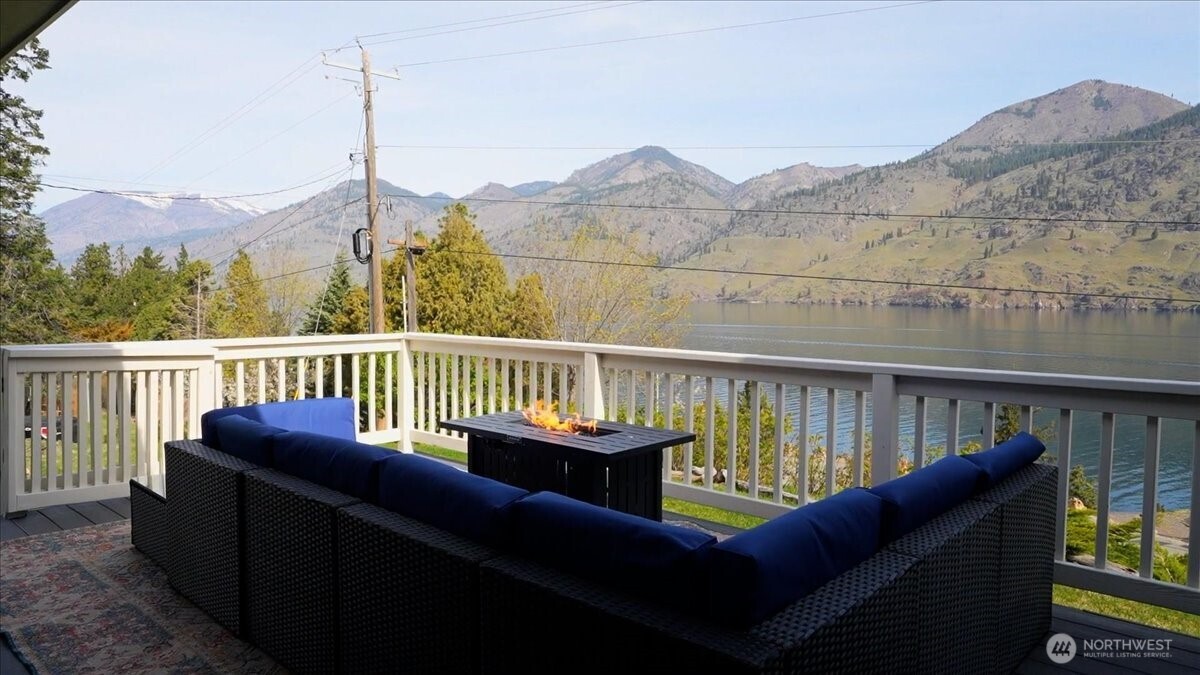 View deck with furniture and fireplace