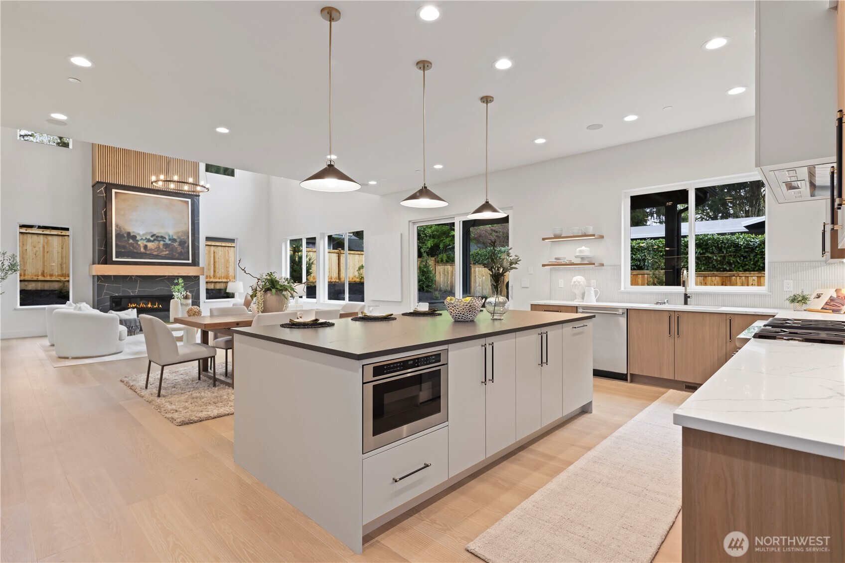 Thermador appliance suite: Side-by-side refrigerator with water dispensor, four freezer drawers and built-in ice maker.