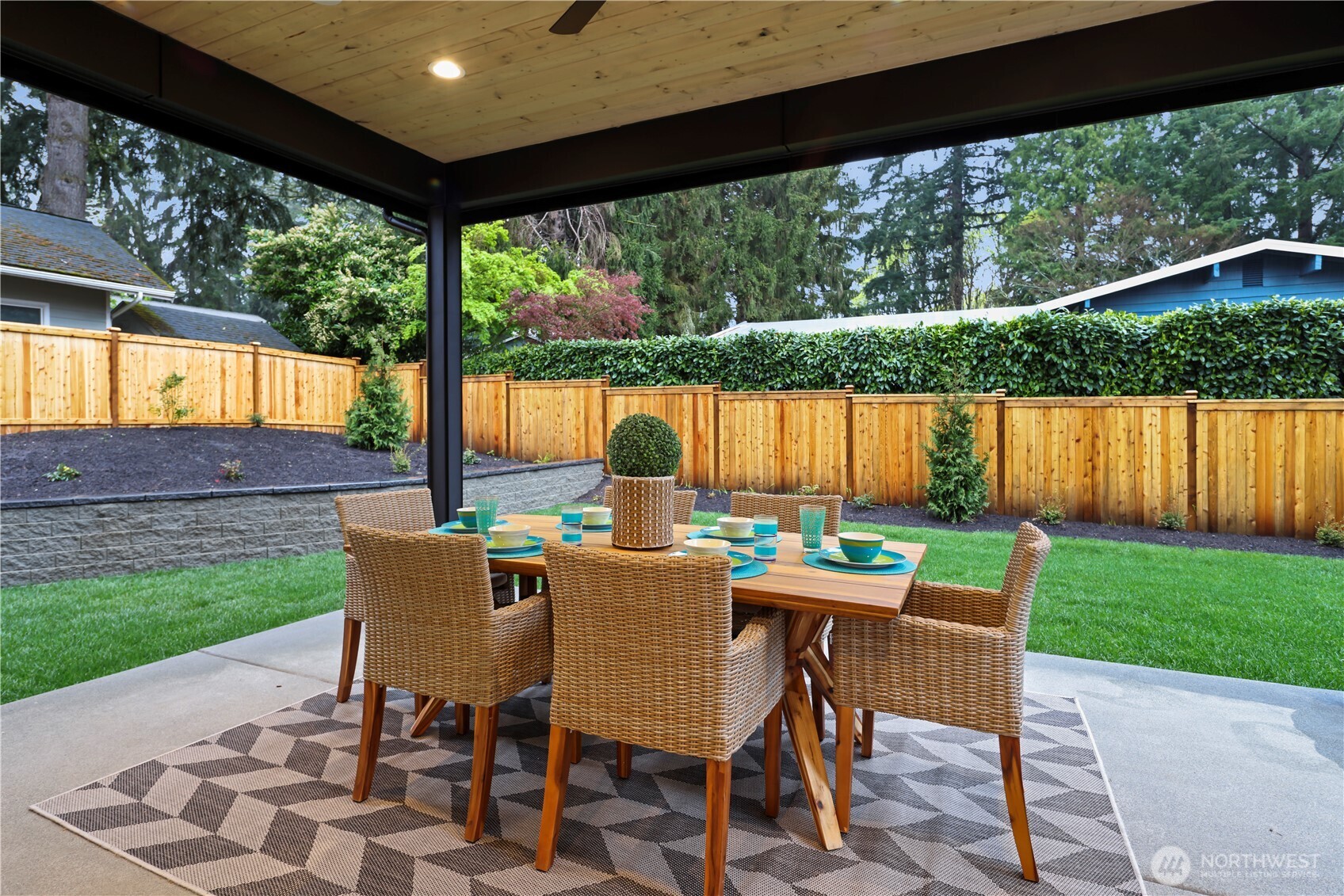 The backyard is fully fenced with a fabulous level grassy area for play. Ceiling fan, prewired for speakers, two gas stubs; one for BBQ and another for a firepit or fire table.