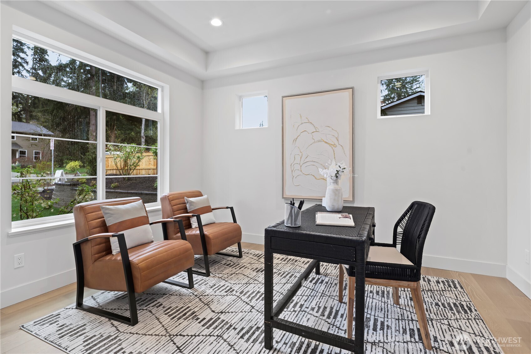 Formal dining with exposed beams, designer lighting and a clean, modern aesthetic.