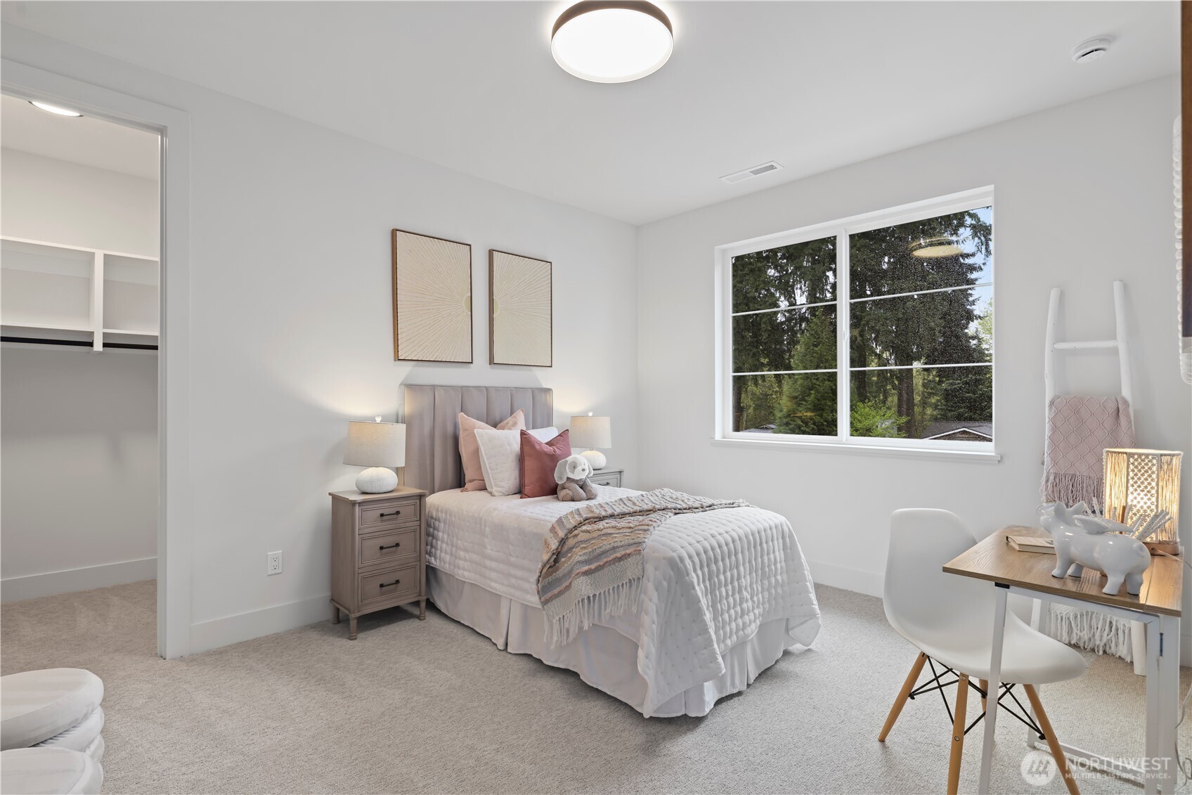Another light-filled south-facing bedroom with large picture window. More than enough room for a queen bed and two nightstands and a walk-in closet.