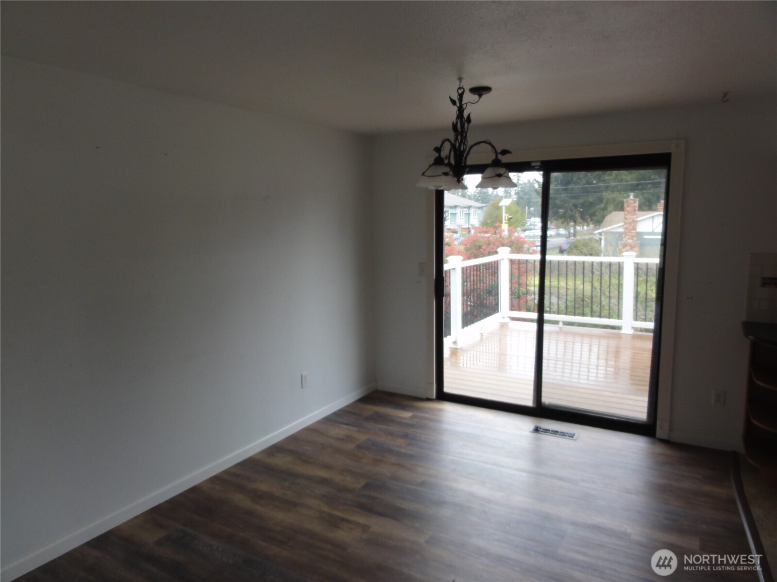 Eating area off kitchen with slider to deck.