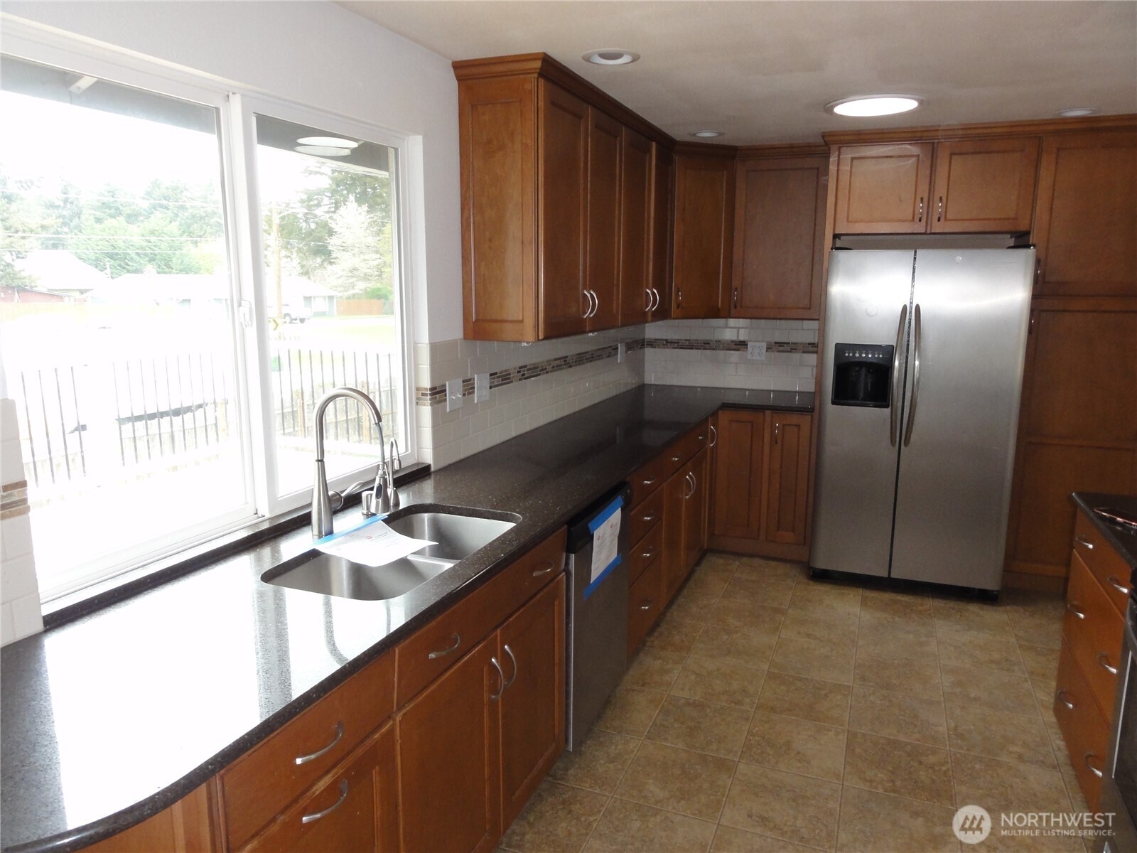 Huge kitchen with plenty of cabinets and counterspace.