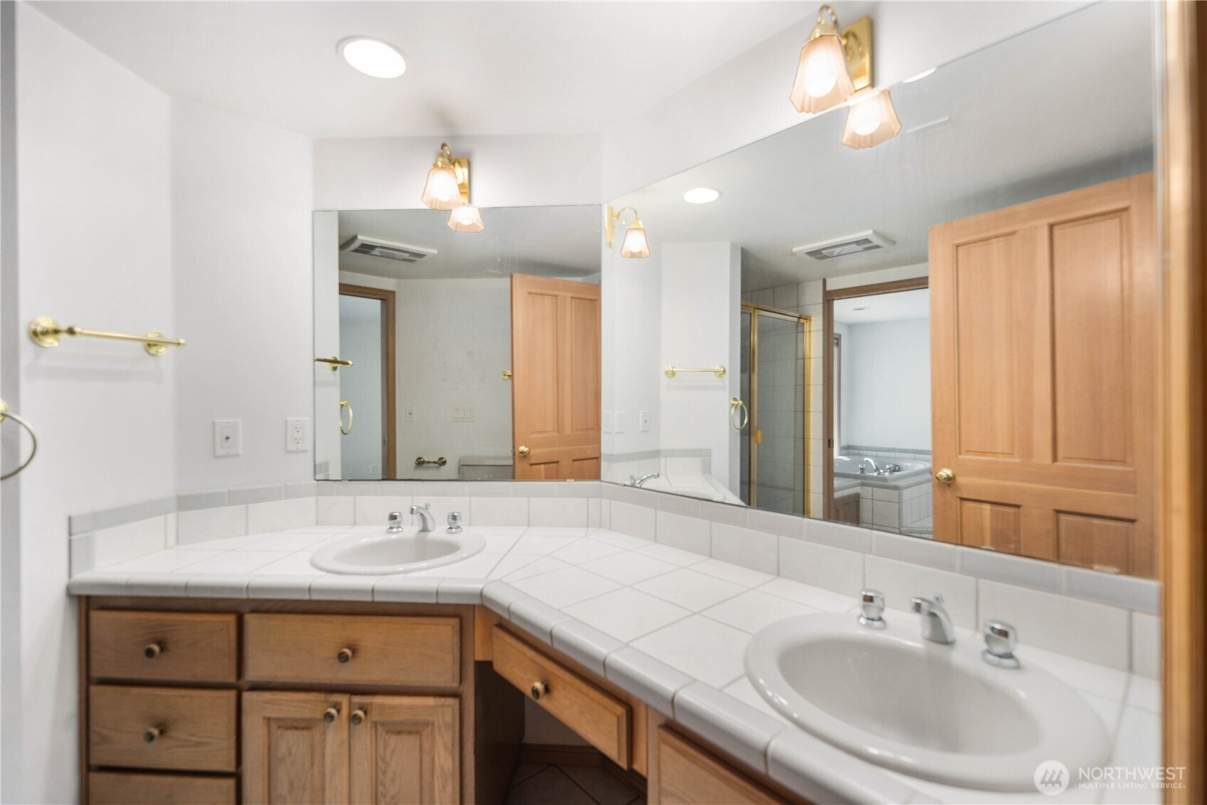 Primary bathroom with shower and dual vanity