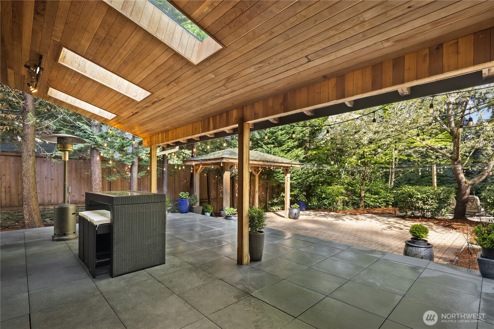 Covered stone patio w/ skylights