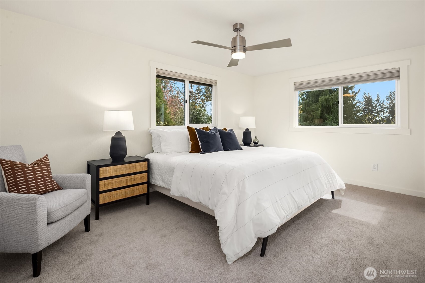 Large primary bedroom with attached 3/4 bathroom.