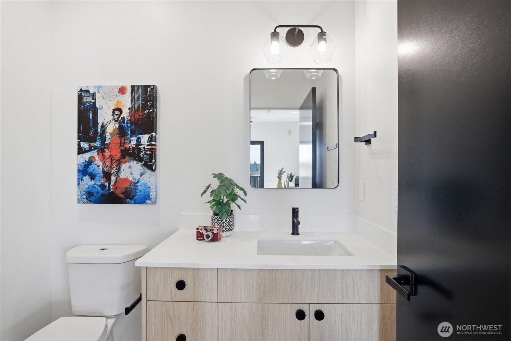 Chic powder room with quartz vanity, modern fixtures, and clean contemporary finishes.