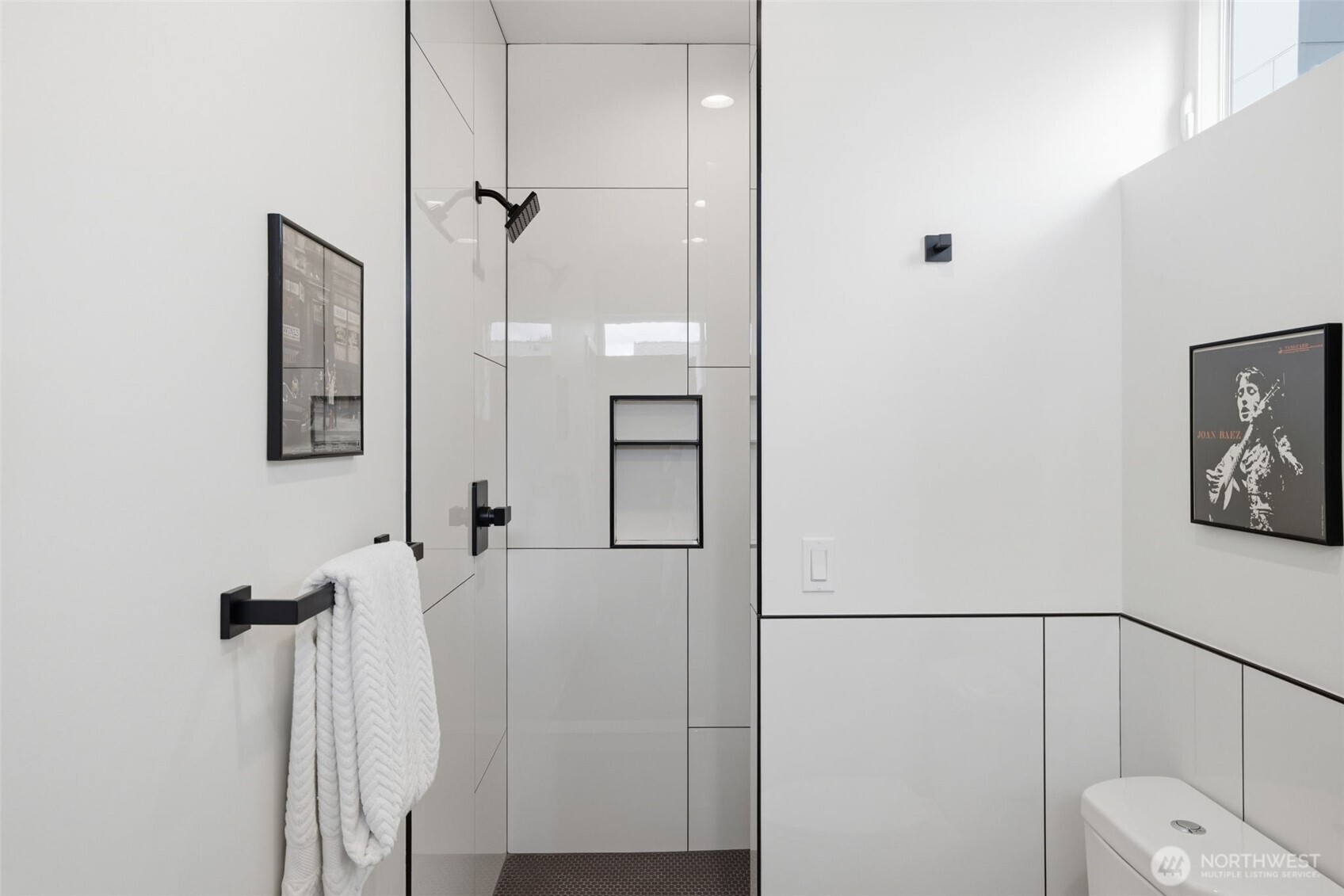 Large walk-in shower with custom, comtemporary tile work.