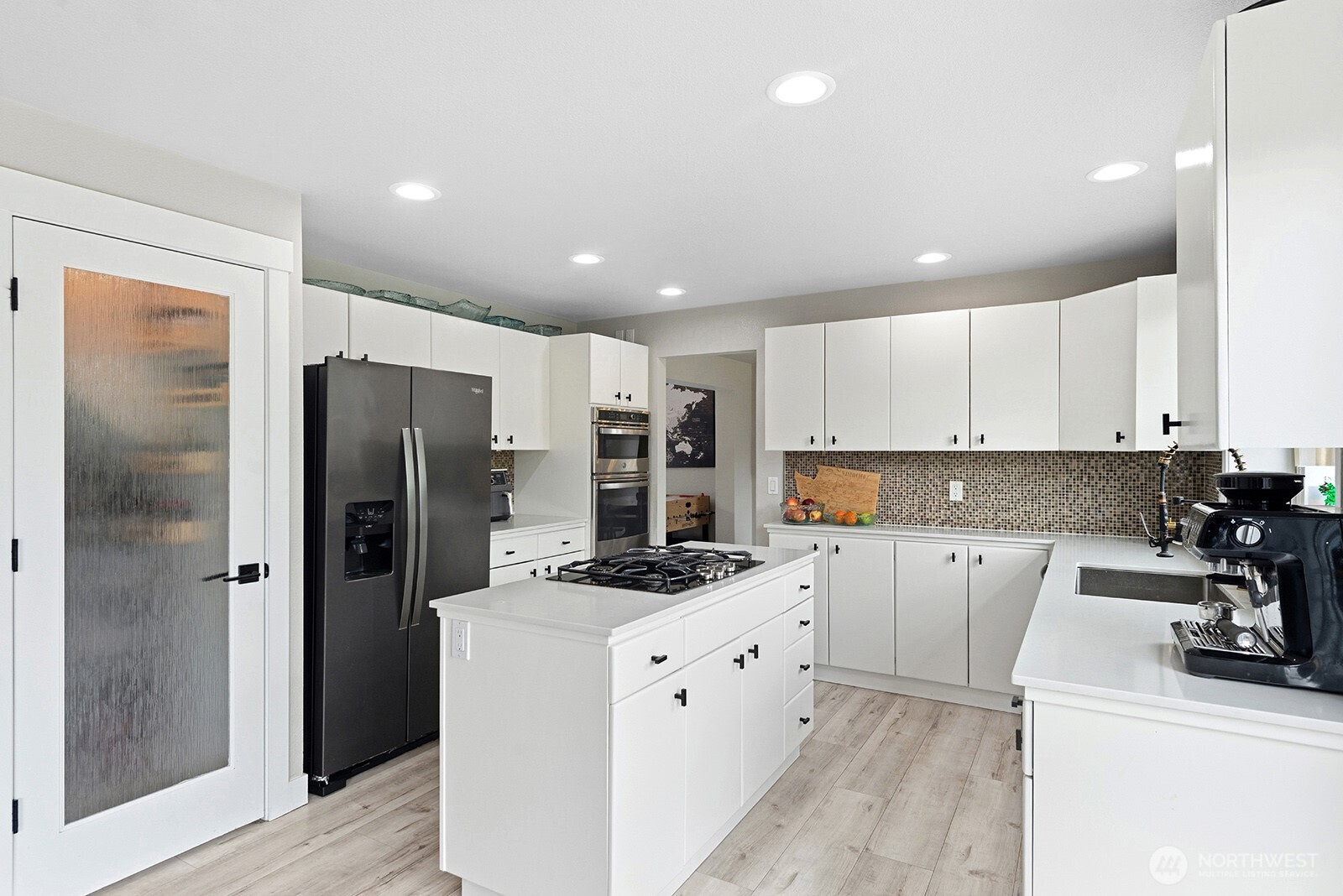 Kitchen offering alot of storage in cabinets and walk in pantry