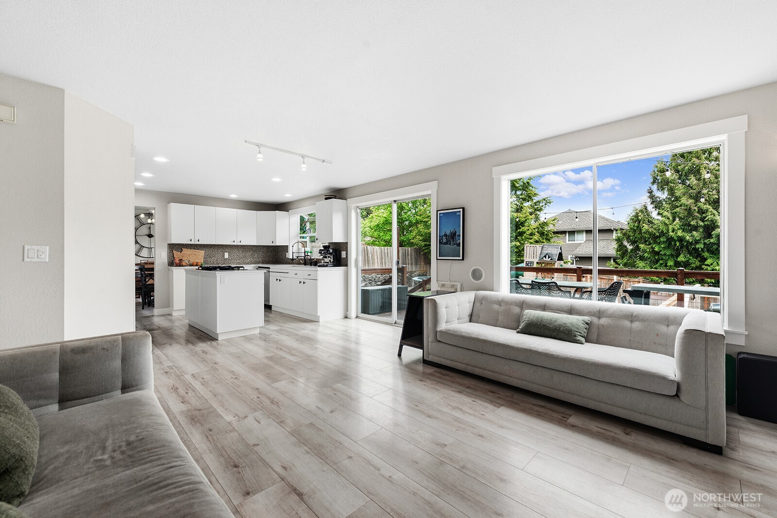 Family Room, looking into Kitchen with slider leading to deck in the backyard.