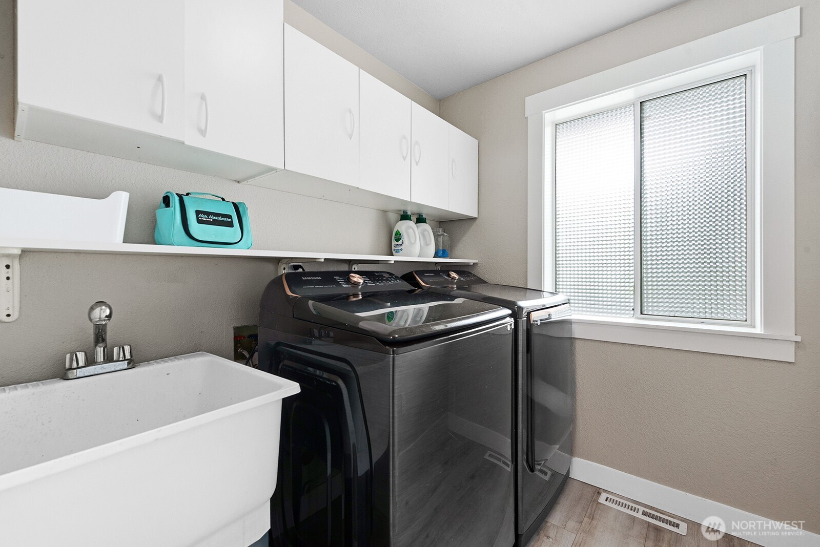 Utility room with sink on main.
