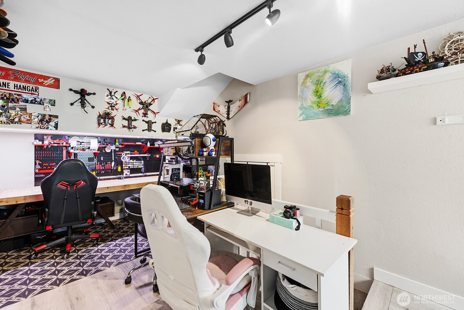 Maker room or office with access to the garagae and walk way into the main level of the home.