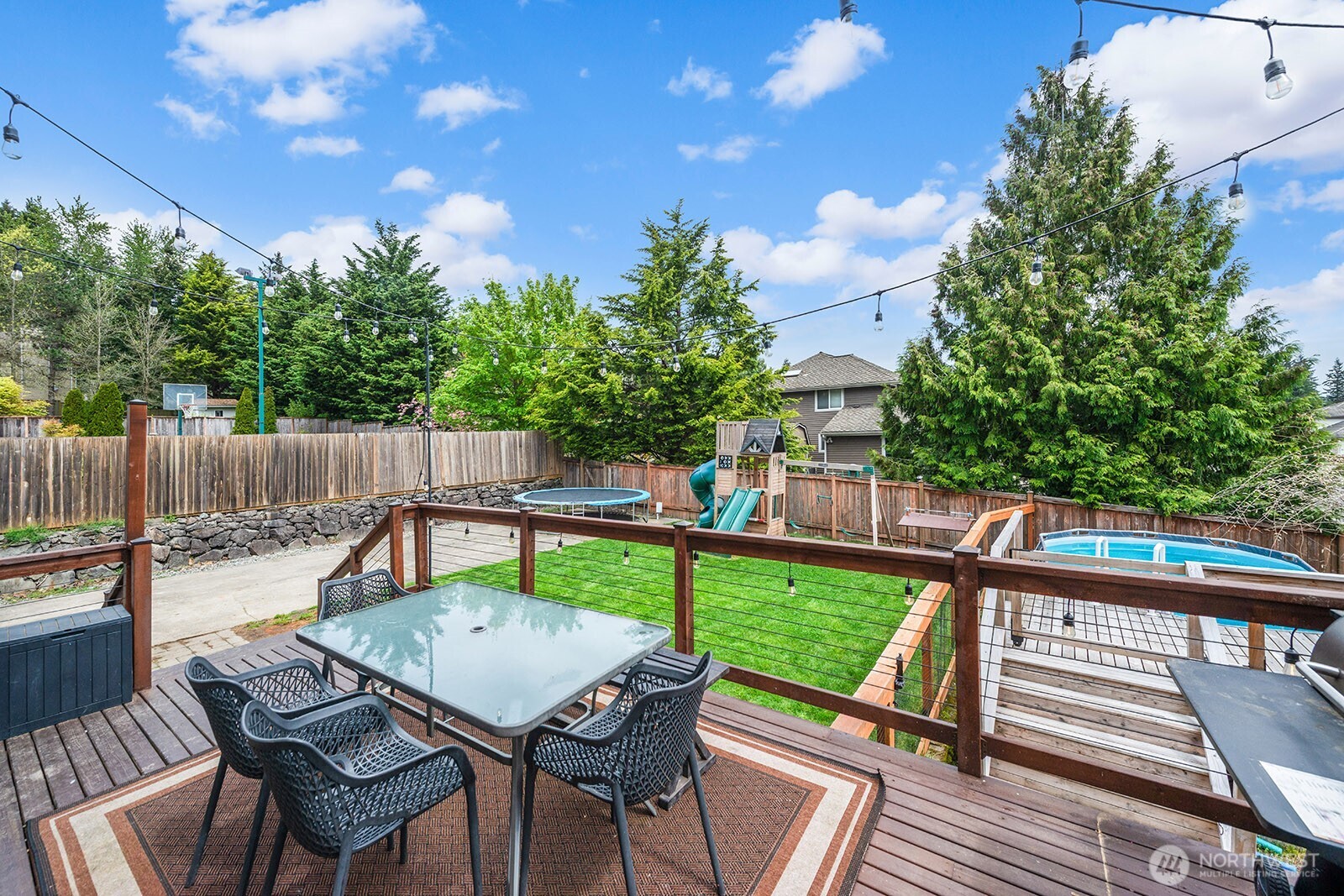 Slider from kitchen leads to newly refinished deck.