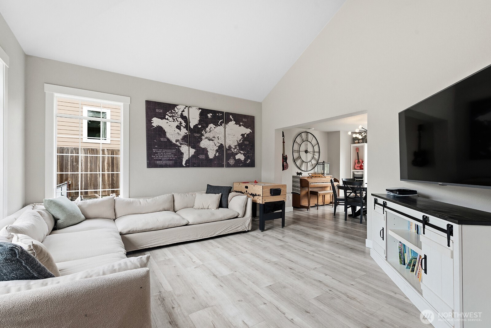Living room with vaulted ceilings.