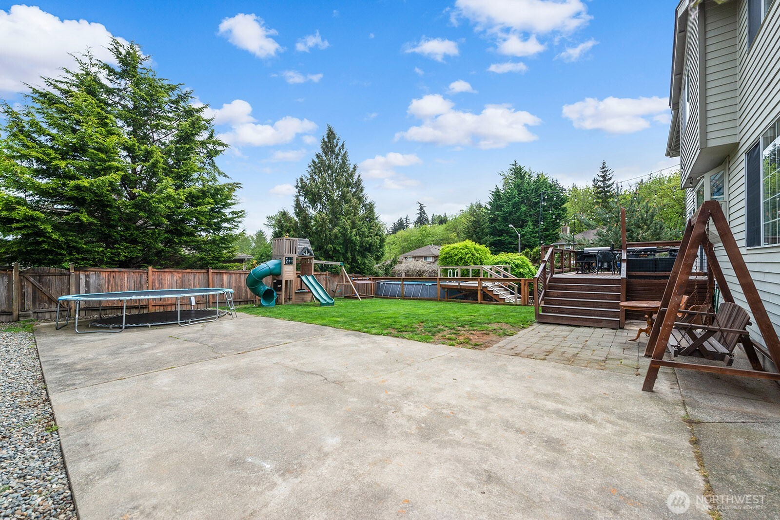 Driveway extends to the backyard offering room for a boat or rv.