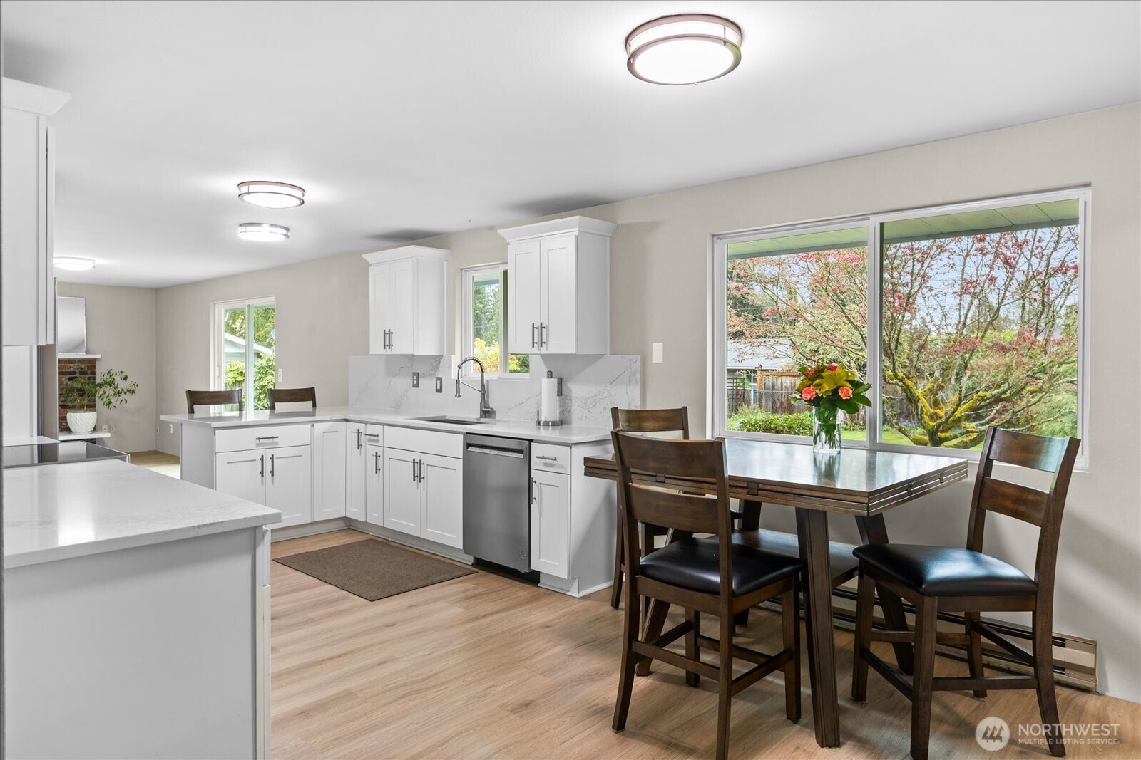 Updated flooring throughout the main living areas in 2023 helps create flow in the home.