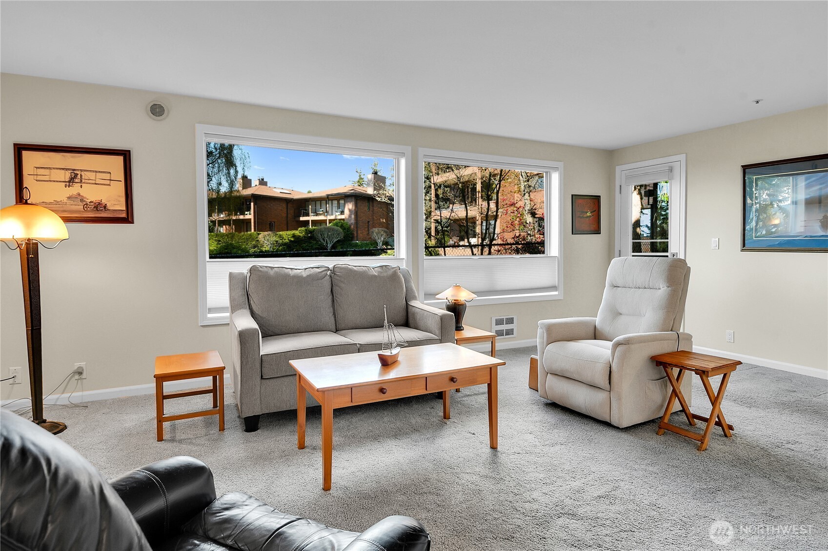 View of livingroom from the dining area, deck access in back