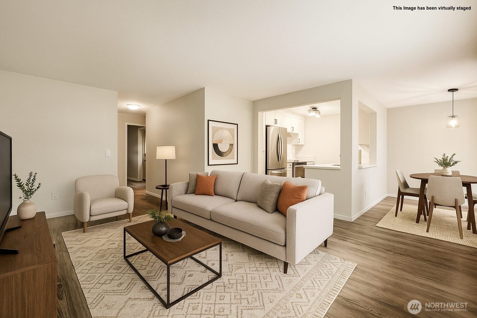 Living room with kitchen and dining area in the background