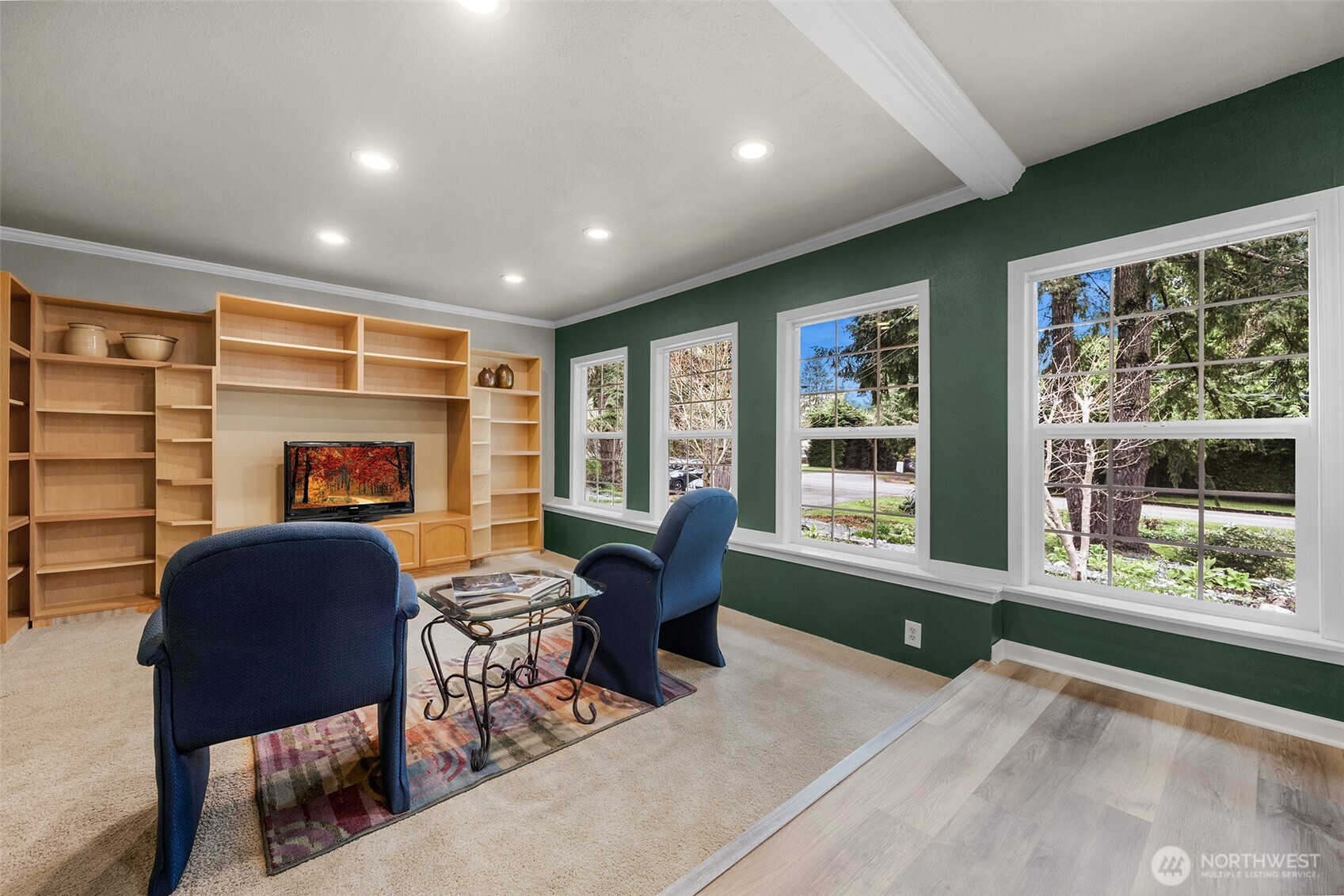 Family room with built-in entertainment center and plenty of natural light.