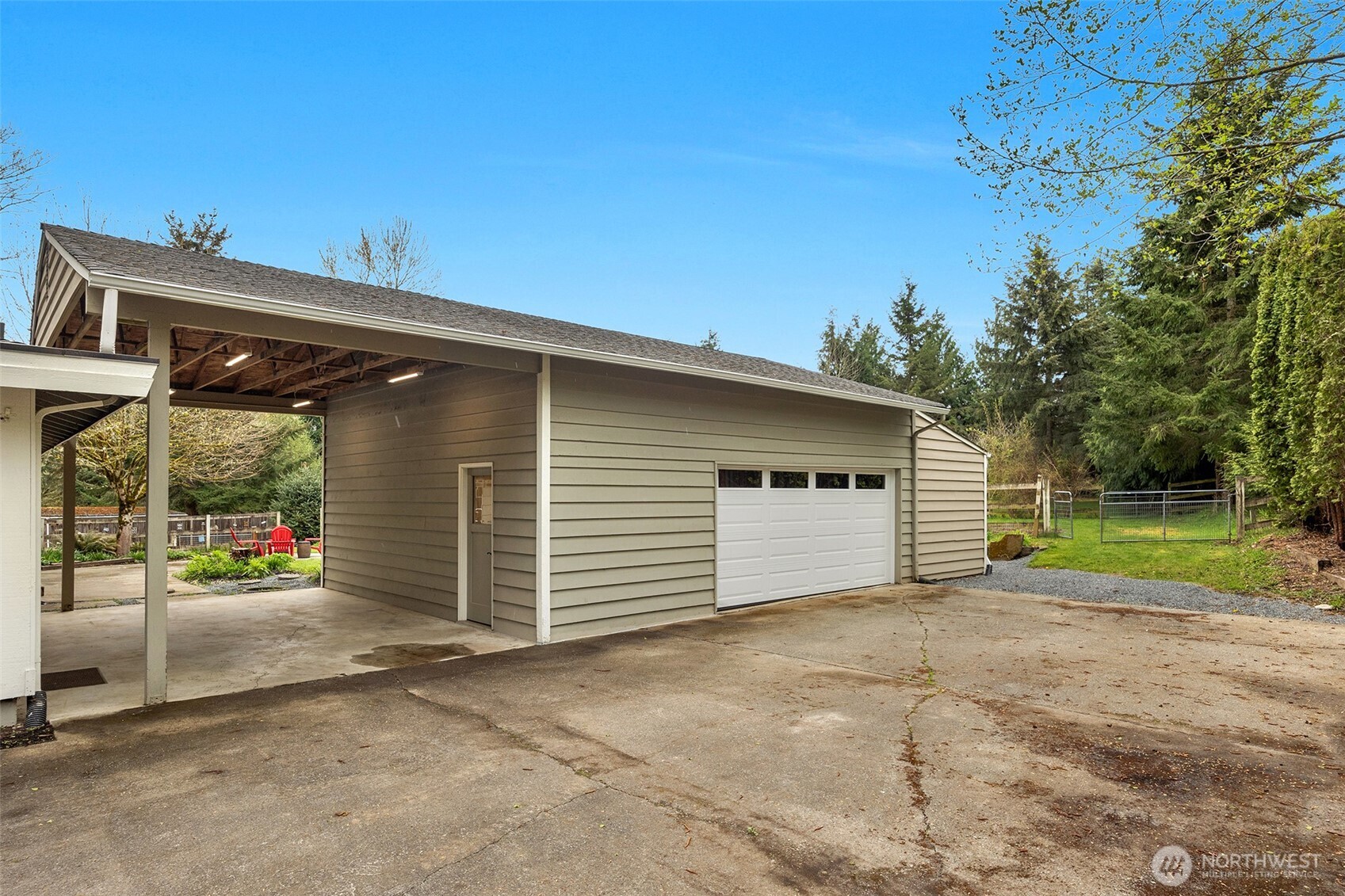 Huge detached garage/shop plus additional covered parking