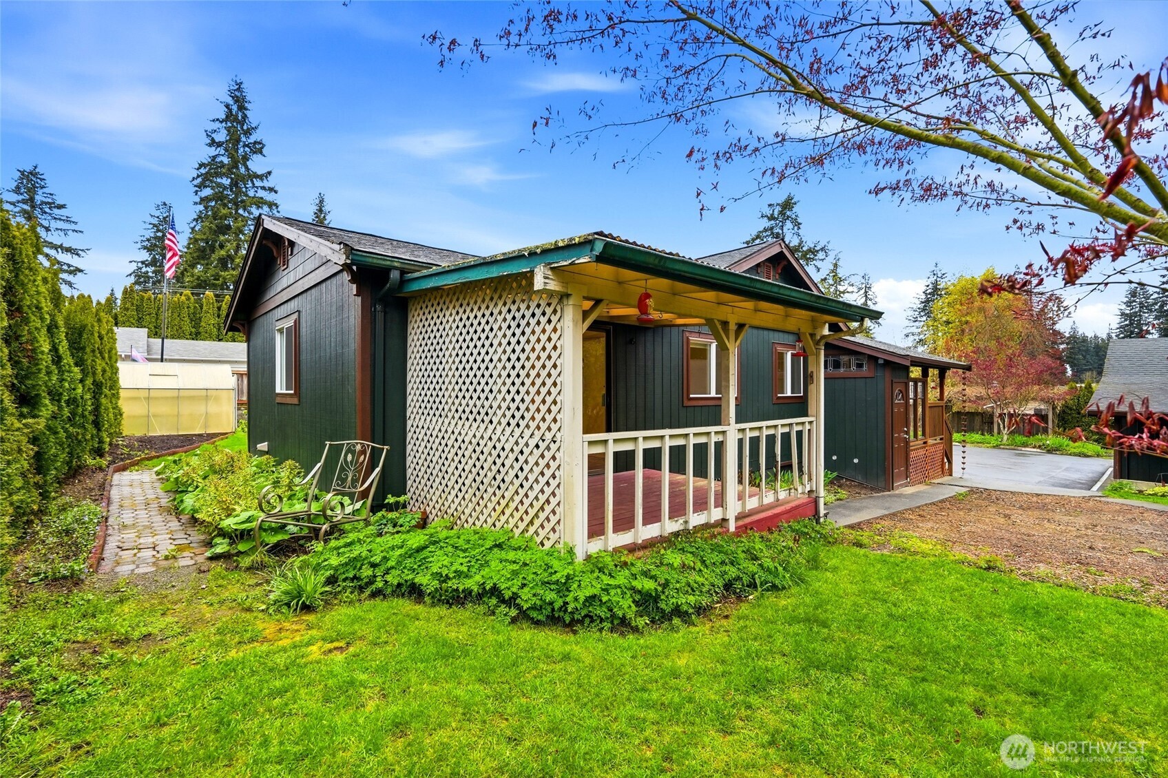 Additional features include a private hot tub, partial fencing with a separate fenced area and chicken coop, and ample room to expand or customize