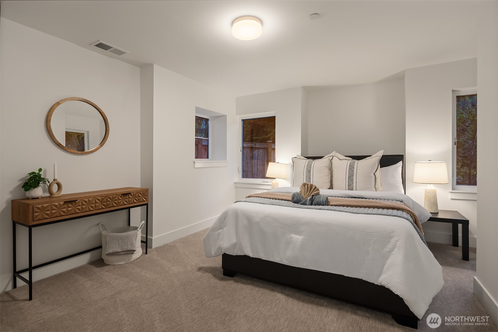 Generous lower-level bedroom with a neutral soothing palate.