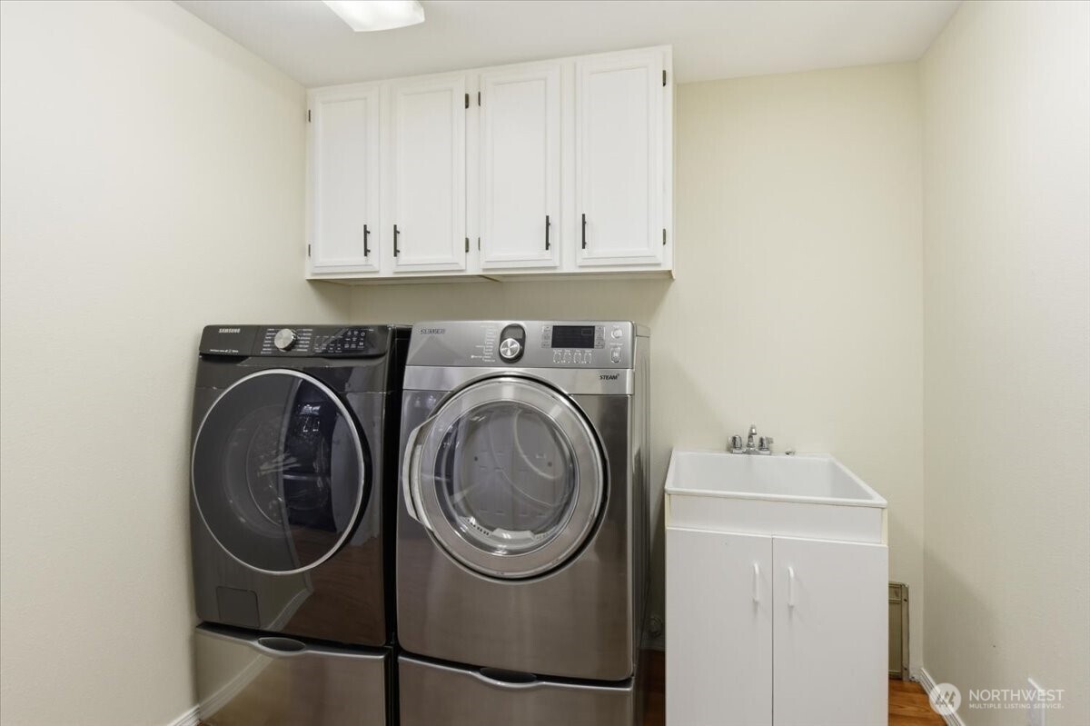 Laundry room with wash tub.  The washer & Dryer stay with transfer.