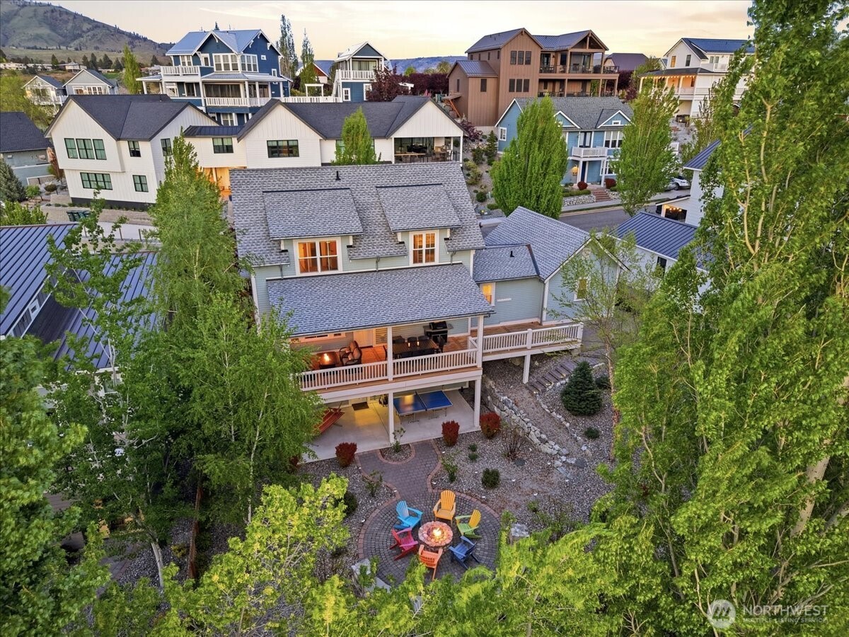 Exterior aerial twilight view of home looking east.