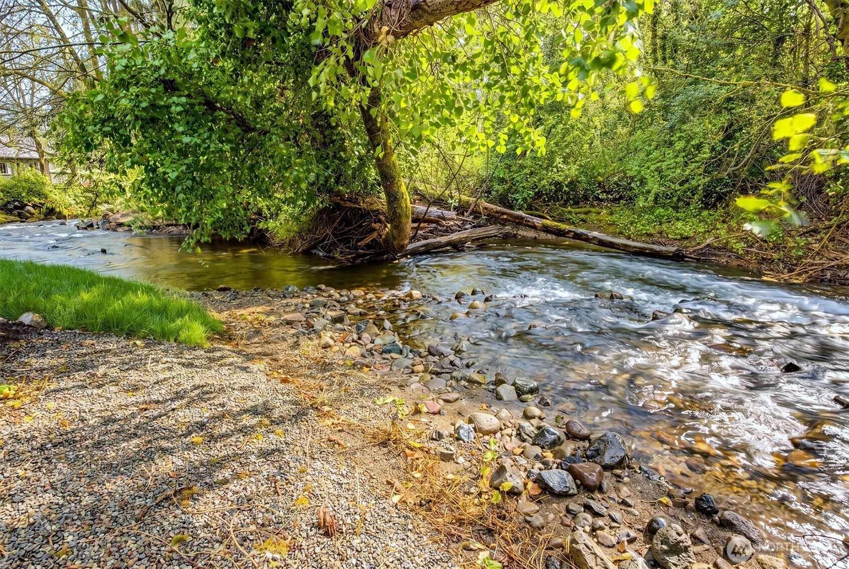 Breathtaking oasis backs to a serene, babbling creek that makes this outdoor space truly one of a kind.