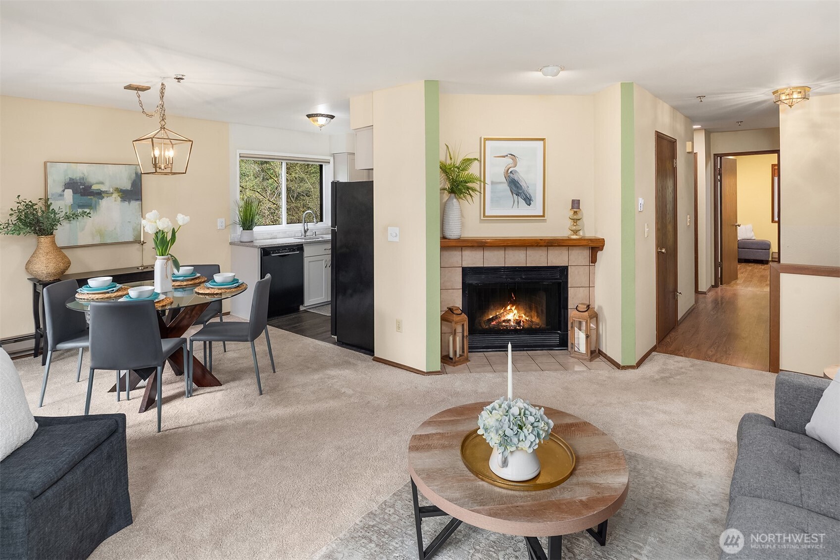 Open floor plan with cozy wood-burning fireplace