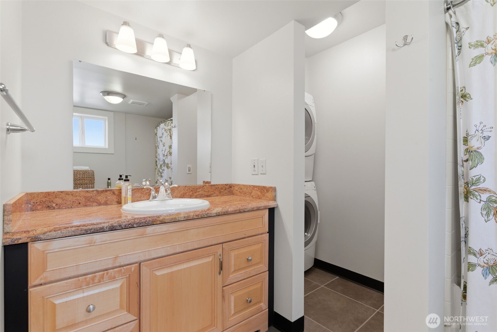 Lower level includes additional laundry.