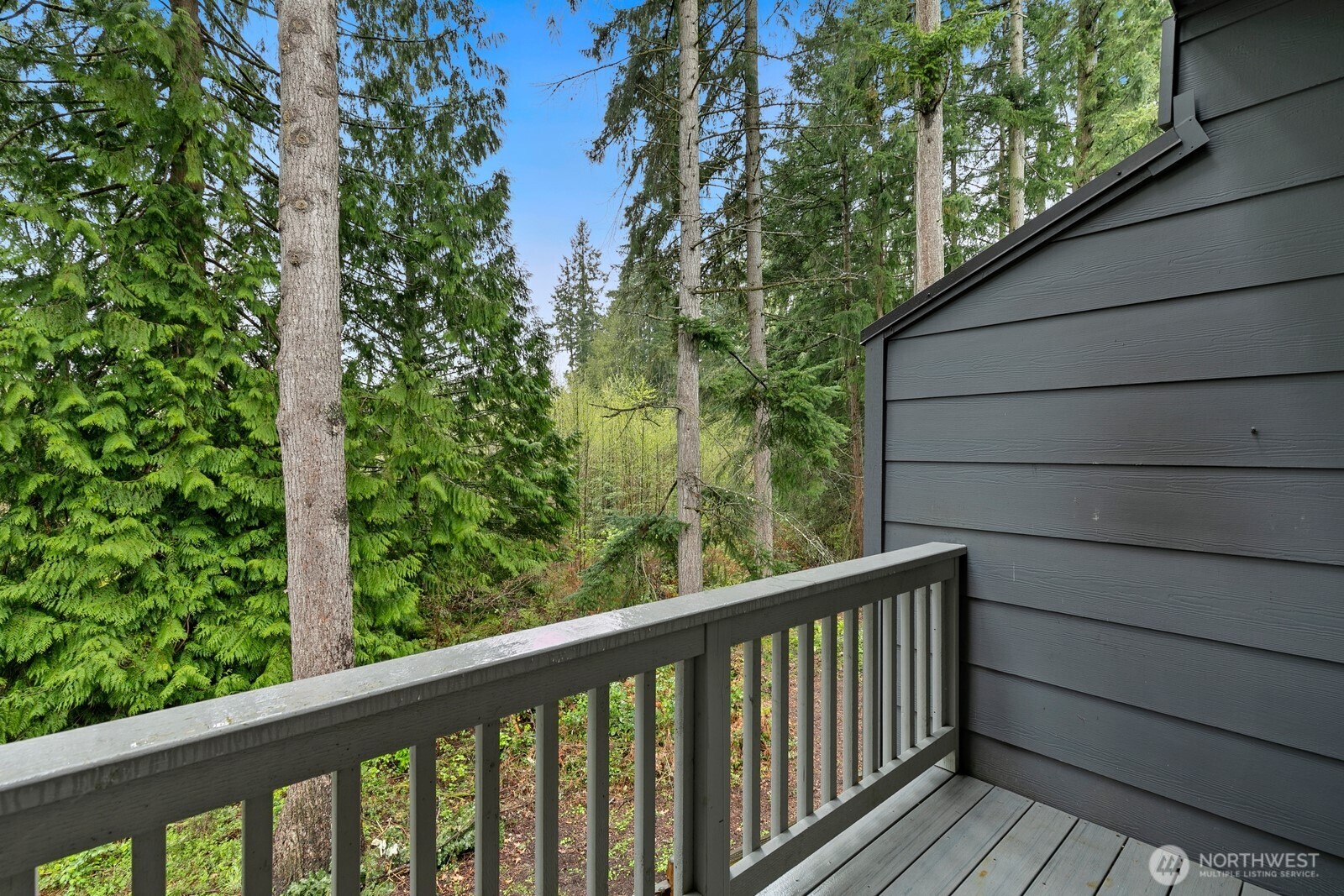 Balcony off main living area, overlooking lush greenery - great for getting away from it all!