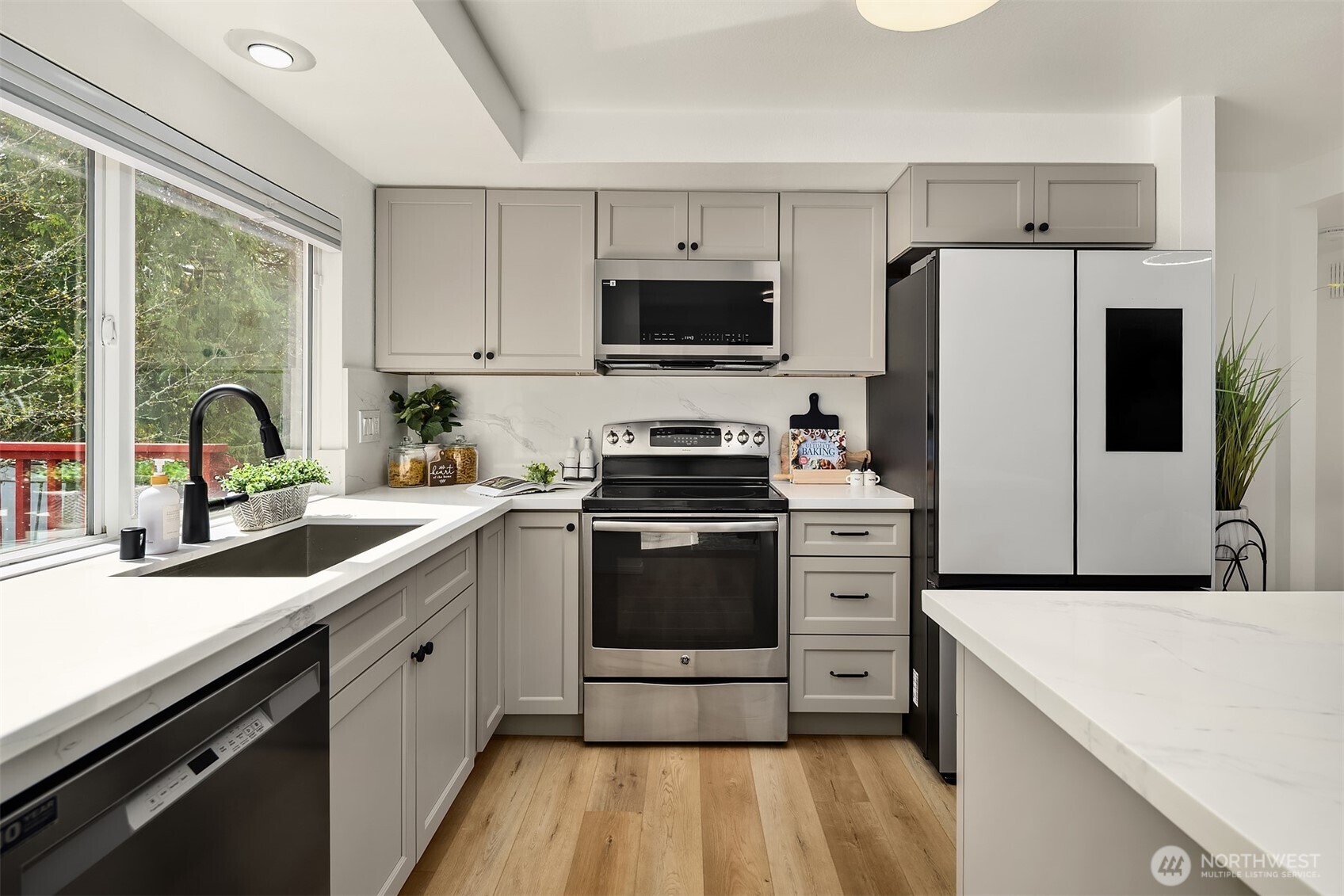 Beautiful kitchen with eat at island will make cooking fun