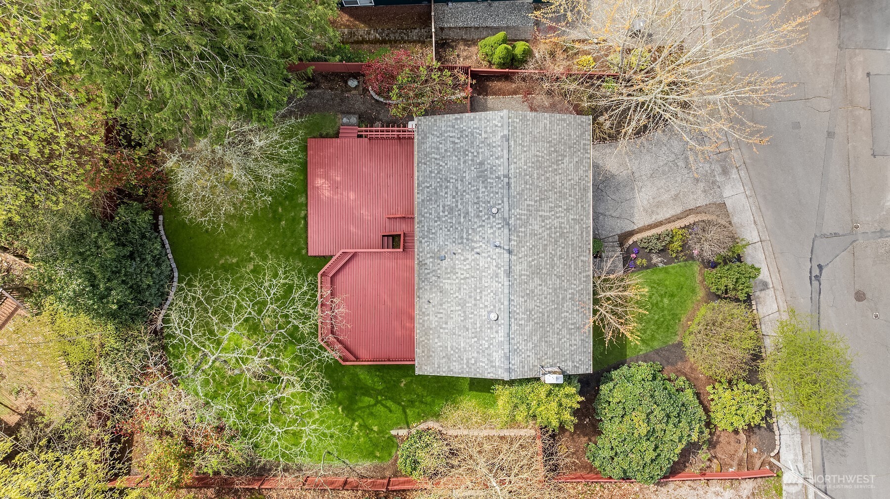 Fully fenced back yard and mature landscaping this yard space is dreamy and feels private