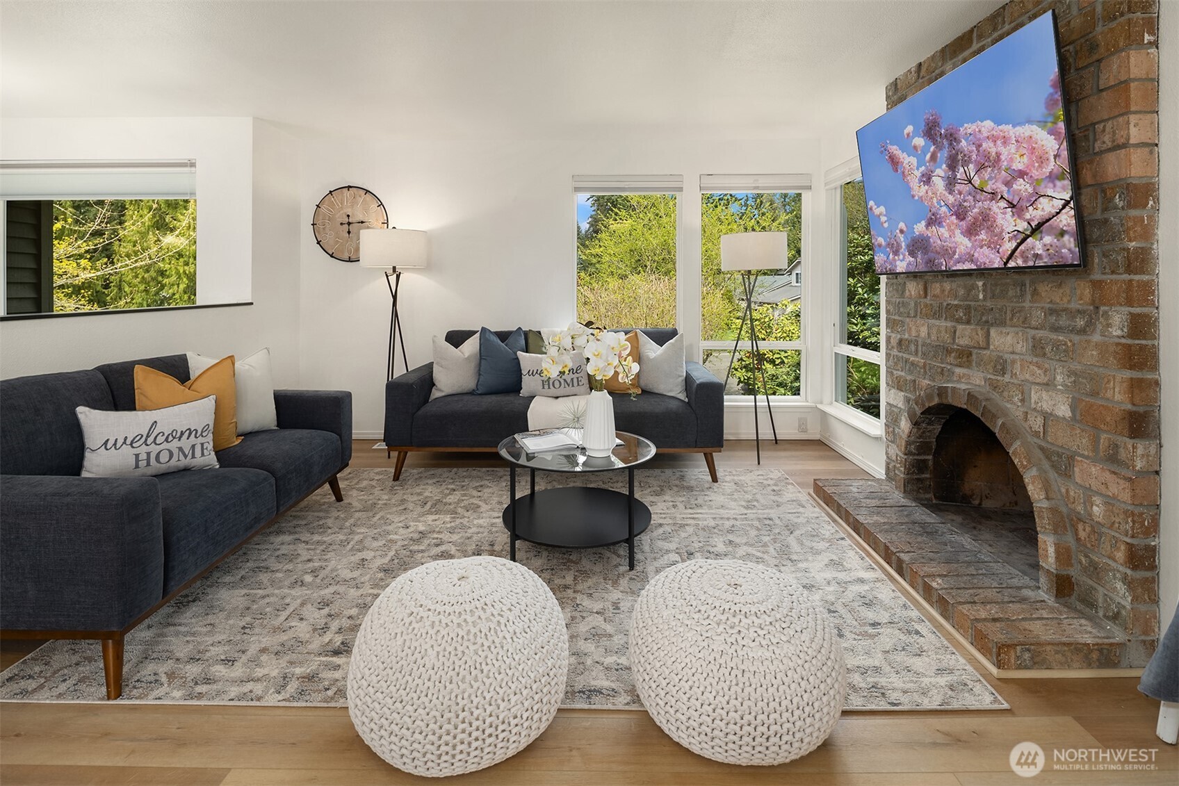 Another view of the living space with new LVP floors and updated windows all equip with blinds