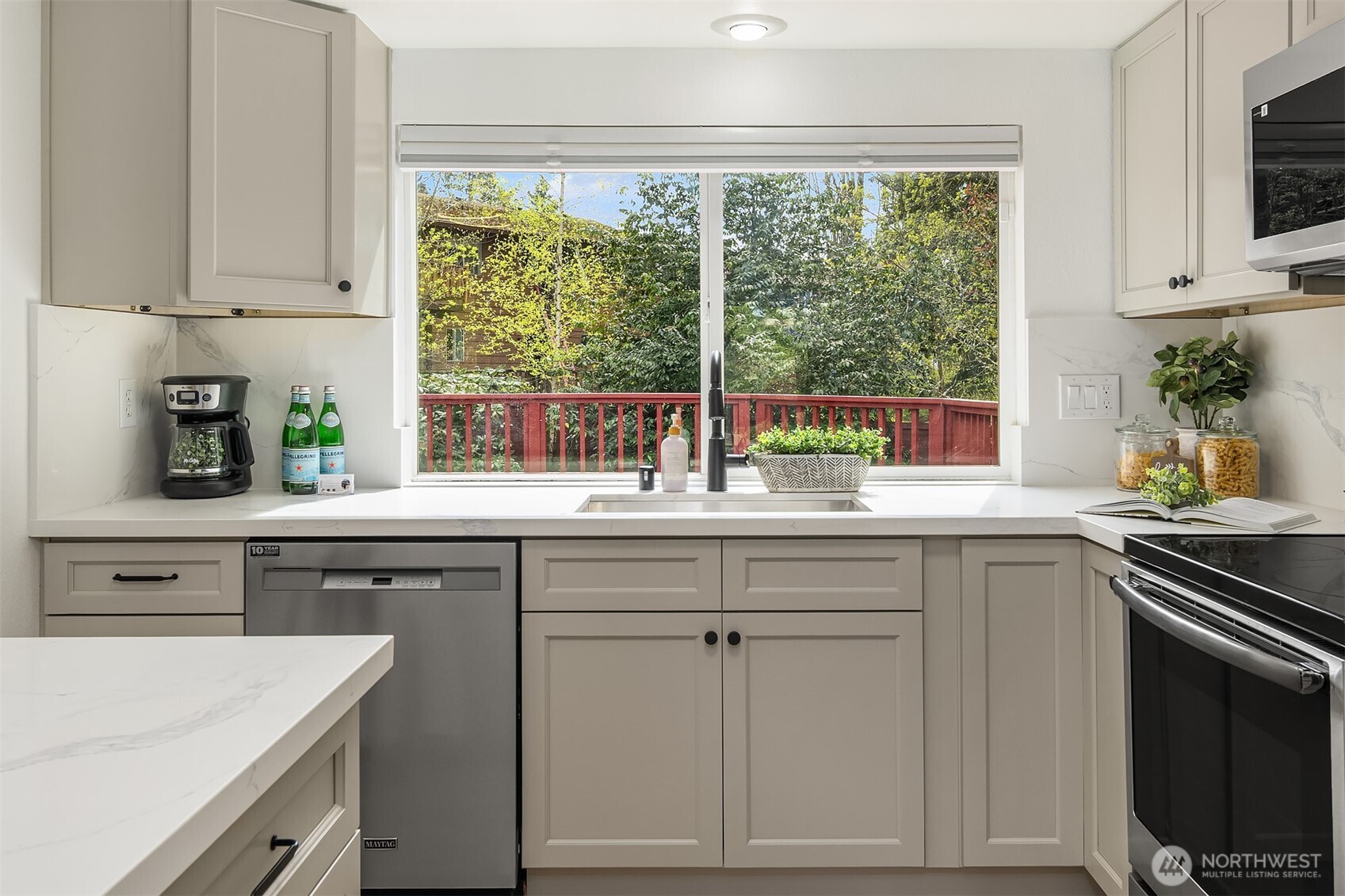 Dishes with a view!! Keep an eye on the backyard easily from the kitchen as your 2 or 4 legged friends play