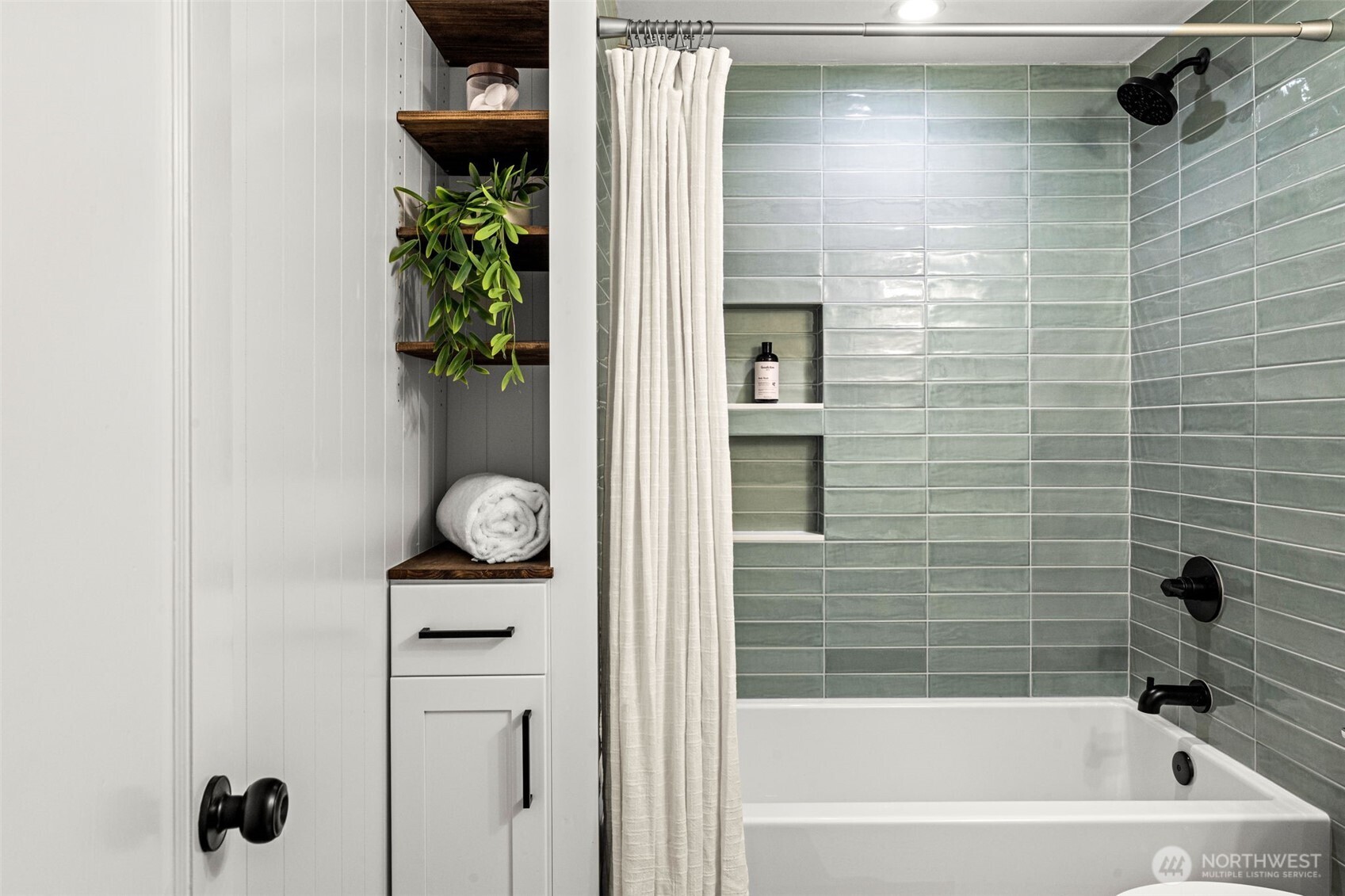 Elegant updated bathroom on main level - all pluming updated.