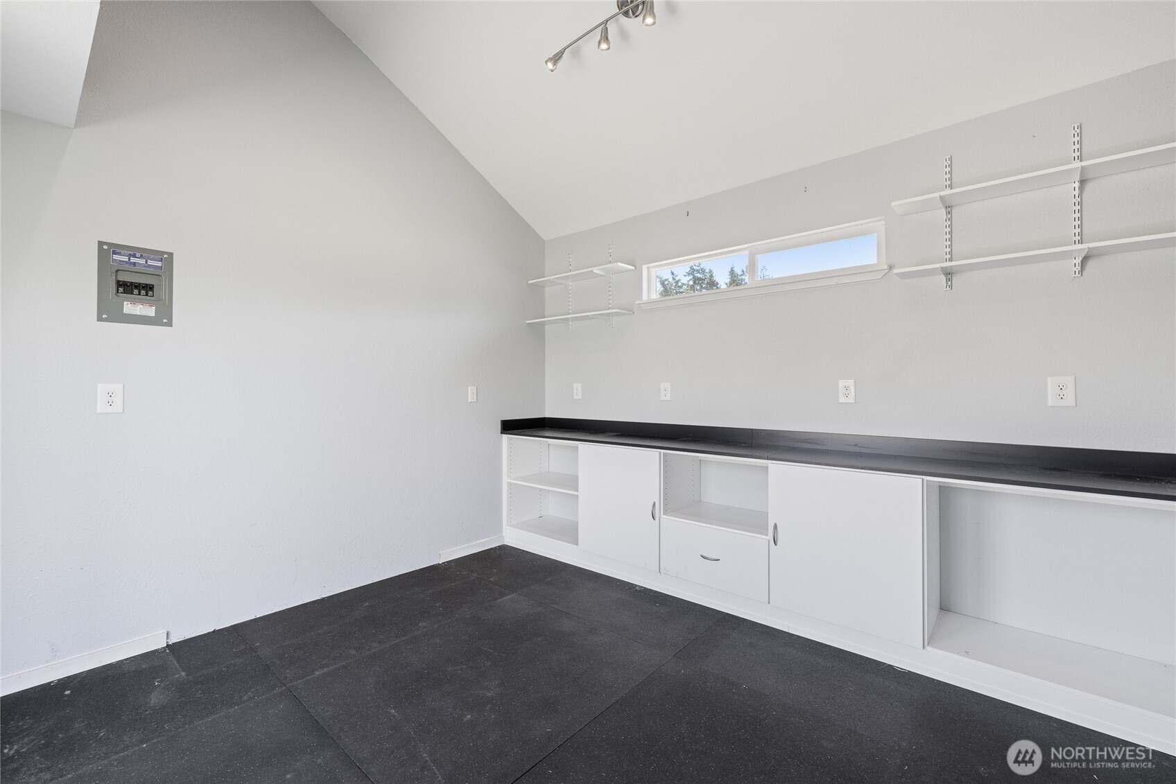 The creative cottage is heated and fully insulated, making it comfortable year-round. Six dedicated solar panels support efficient use, while built-in cabinetry and durable rubber mat flooring add functionality. French doors bring in natural light and charm, and a small loft offers additional storage or flexible creative space.