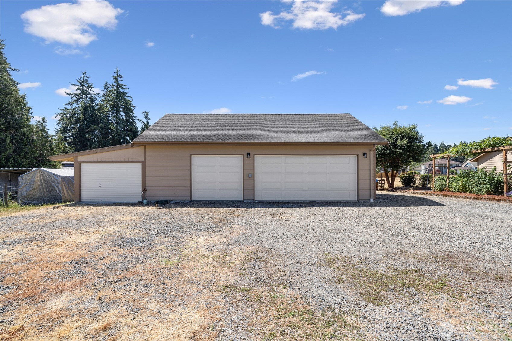 The garage and shop are fully insulated and equipped with a ductless heat pump for year-round usability. The space is piped for an air compressor, which stays with the property, and includes a 50-amp outlet for electric vehicle charging. Built-in cabinetry and a mini fridge are included, along with a dedicated gun safe cabinet (safe not included). A 220-volt welding plug and a 200-amp service panel support a wide range of uses....